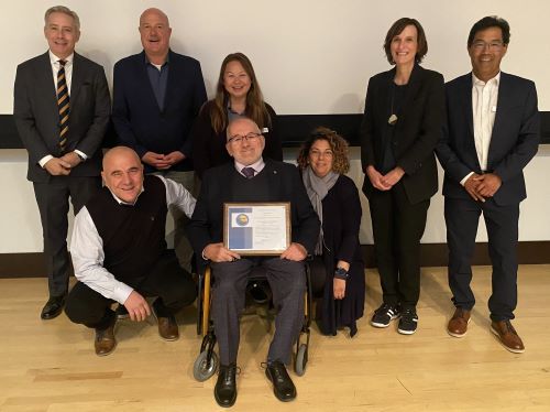 Commissioner Mikiten with commissioners and certificate