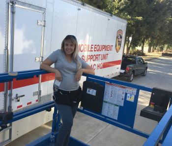 Kristina with a semi truck decal job