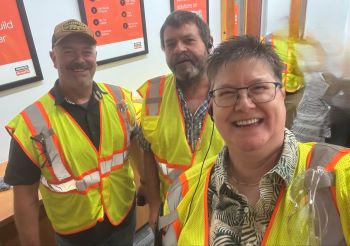 Tim, Tom and Carol in yellow safety vests