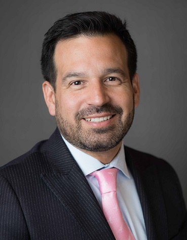 Jose Fierro pink tie, white collar shirt, black suit