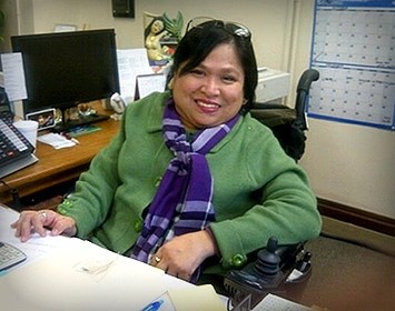 Picture of Lillibeth Navarro.  Green top and purple scarf