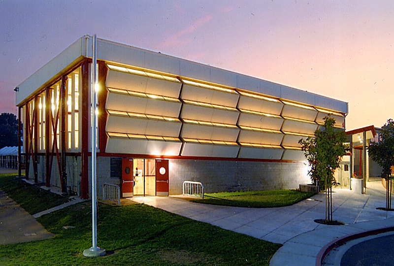 An image of the front of the Blach gym at dusk.