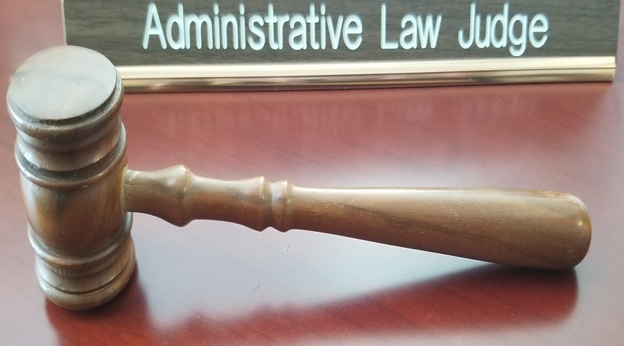 Image of gavel and name plaque