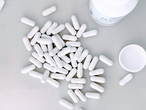 pill bottle with pills on a table