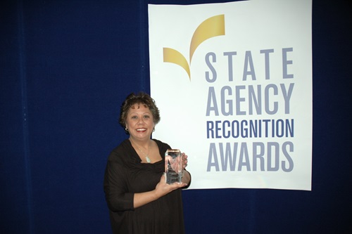 Jessica Spencer accepts the most improved DVBE participation award for the California department of education for the medium agency category