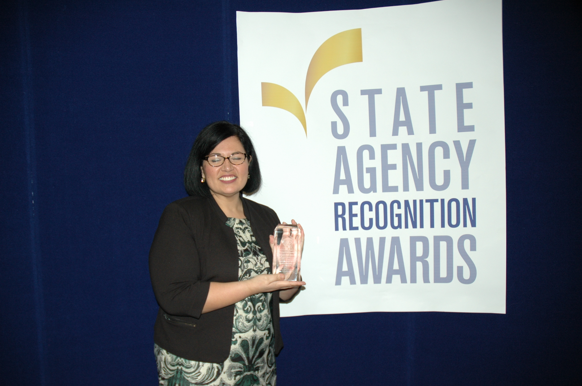 Alice Rodriguez accepts the most improved DVBE participation award for the California High-Speed Rail Authority for the extra large agency category