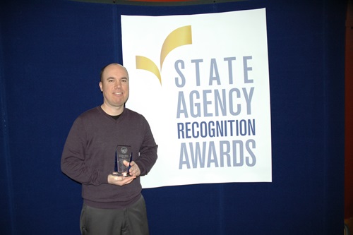 Mario Solis accepts the Bronze SARA award for the California Department of Transportation - Training and Outreach branch office of business and economic development
