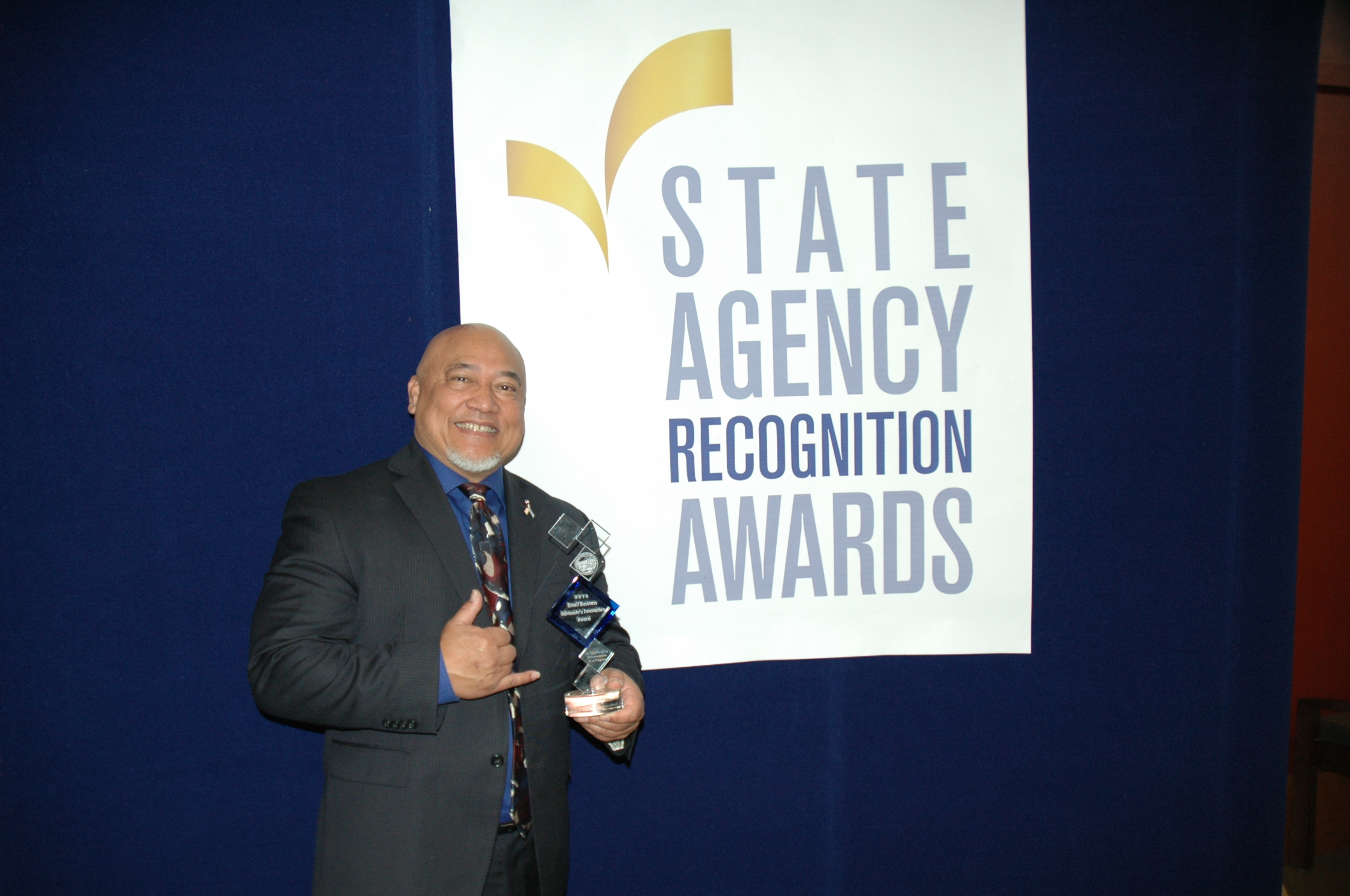 Michael Aguillio, Department of general services, accepts the small business advocate innovation award