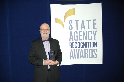 Wayne Gross, Department of general services, accepts the Secretary's special achievement award