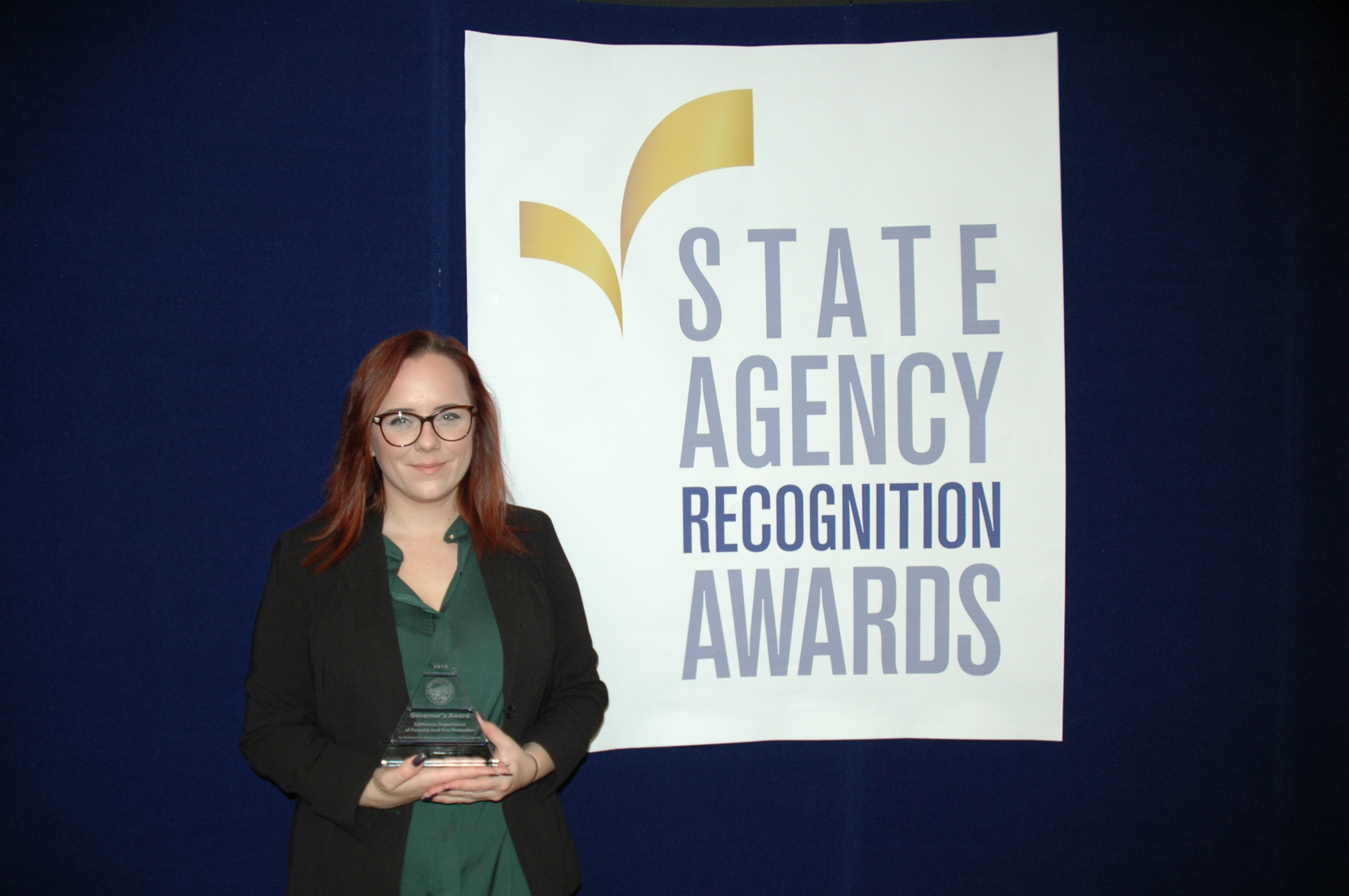McKensie Pimley accepts the Governor's Award for the California department of forestry and fire protection