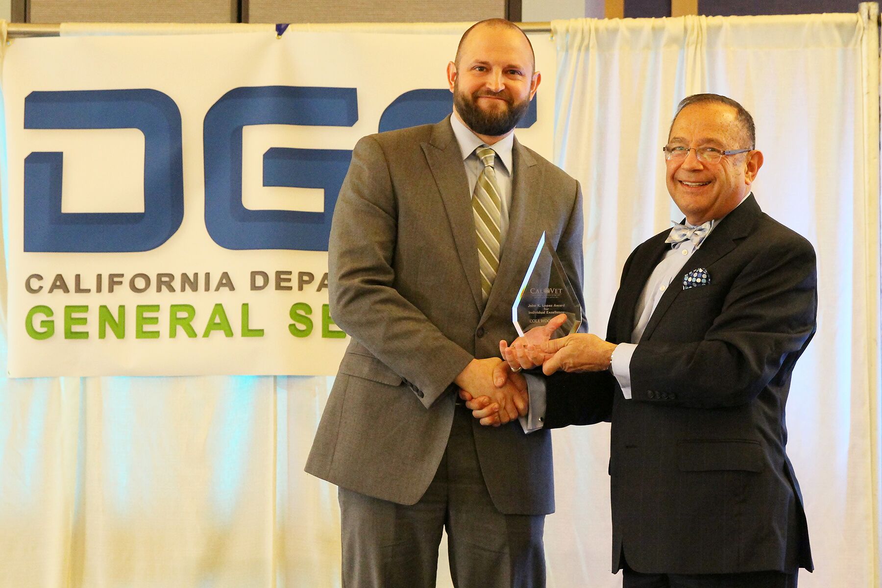 Cole Woodman, Global Engineering Services, Inc. accepts the John K. Lopez Award for individual business excellence