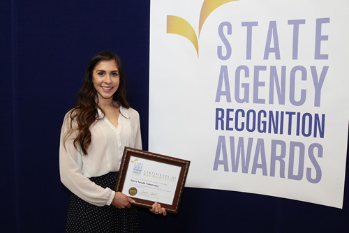 Amanda Grant accepts the most improved DVBE participation award for the Sierra Nevada Conservancy for the extra small agency category