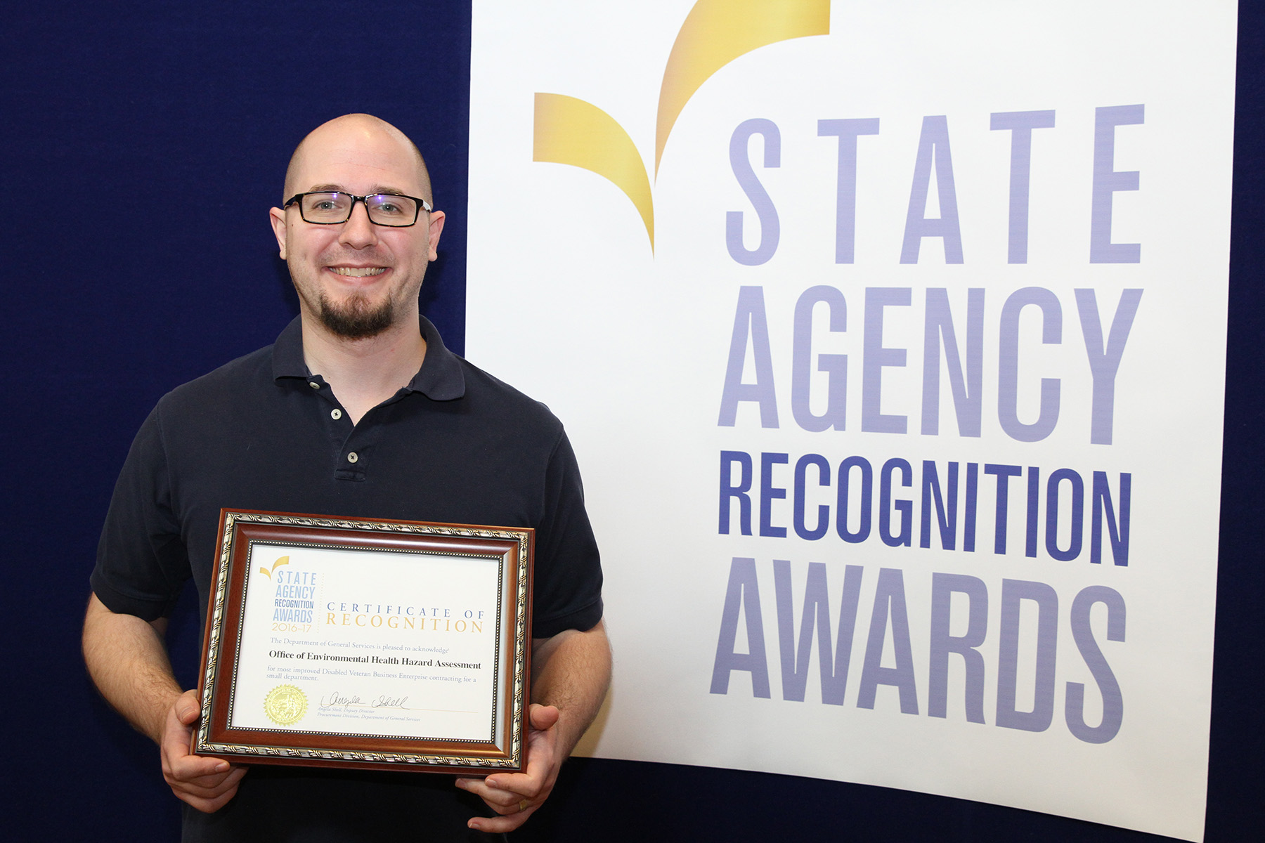 Anthony Picciano accepts the most improved DVBE participation for the Office of Environmental Health Hazard Assessment for the small agency category