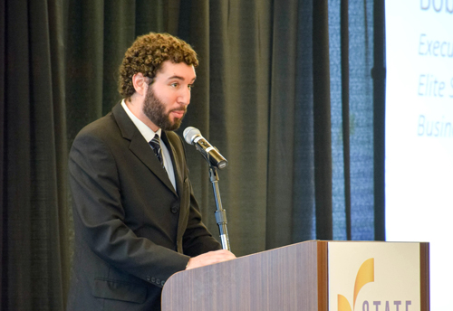 Matt Zweier stands at the podium