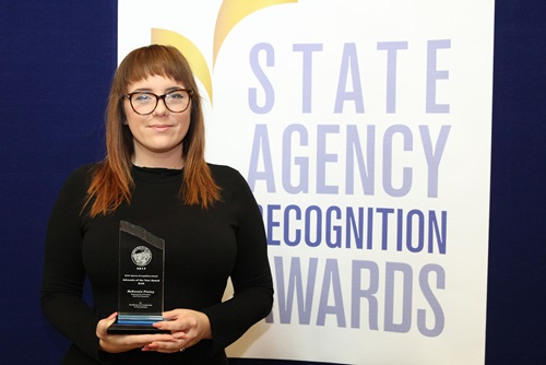 McKensie Pimley, Department of Forestry and Fire Protection, accepts the Gold advocate of the year award.