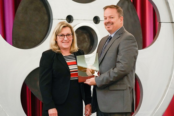Rhonda Smith, Department of General Services, presents the Department of Public Health with the Silver Agency of the Year award.