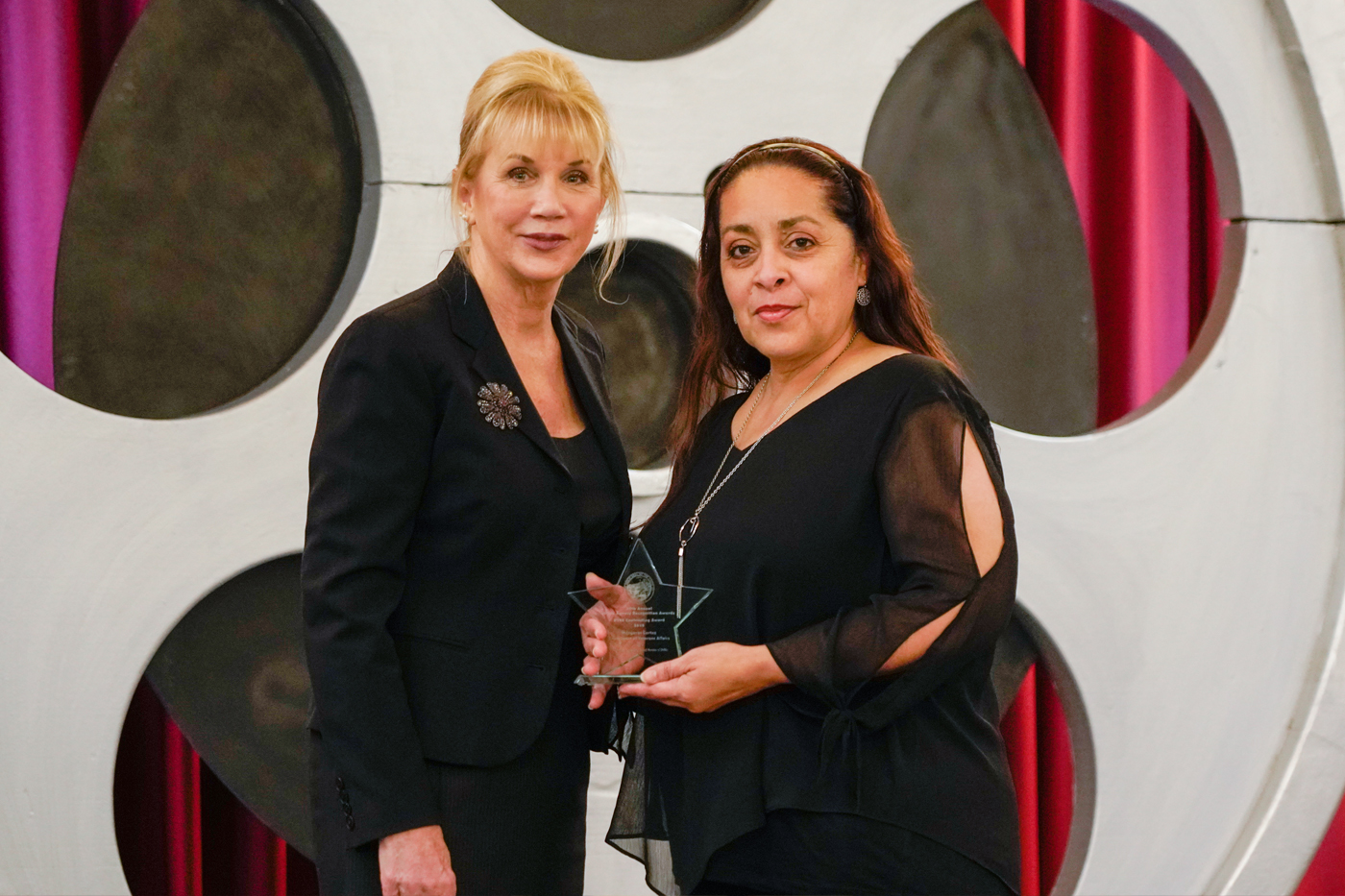 Margaret Cortez: Nancy Huth, Department of General Services, presents Margaret Cortez, Department of Veterans Affairs, with the DVBE Contracting Award.