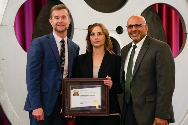 Keith Boylan, Department of Veterans Affairs, present the California State University, Humboldt with the award for Most Improved DVBE Contracting for a large agency.