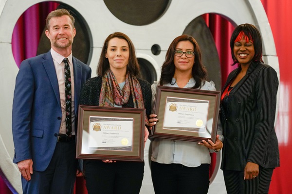 Keith Boylan, Department of Veterans Affairs, and Demeshia Swanson, Department of General Services, present the Military Department with the award for Most Improved Small Business Contracting and Most Improved DVBE Contracting for an extra large agency.