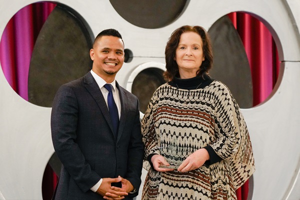 Christopher Calceta, Department of General Services, presents Tammy Kirkwood, Department of Corrections and Rehabilitation, with the Small Business Contracting Award.