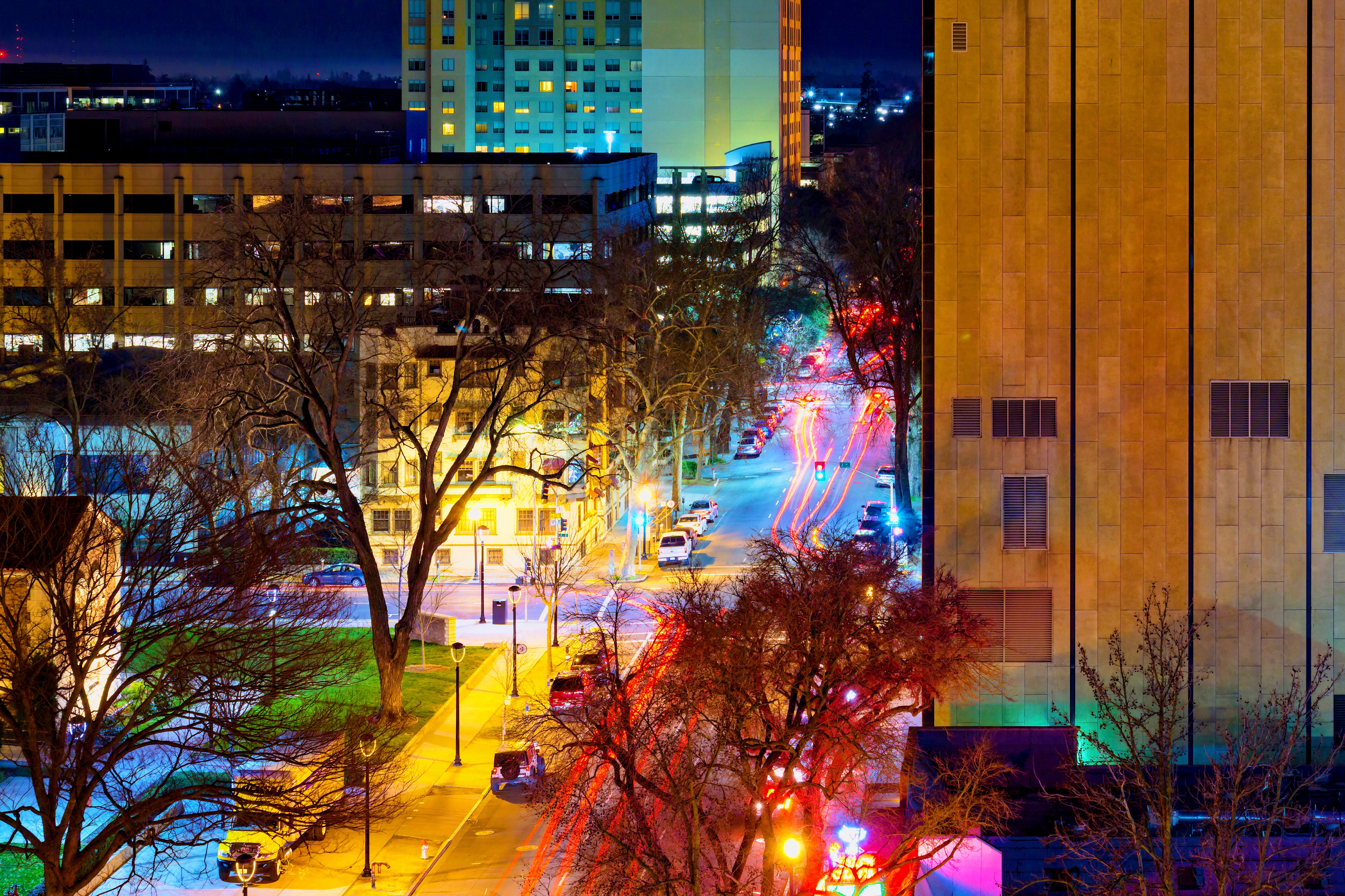 Slow shutter image of street lights on a busy night in Midtown