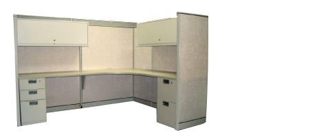 Picture of a cubicle with a desk and cabinets